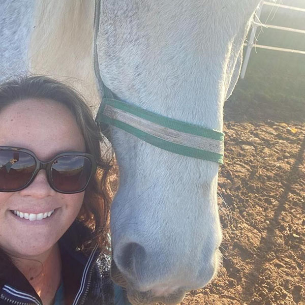 Lauren Underhill with white horse